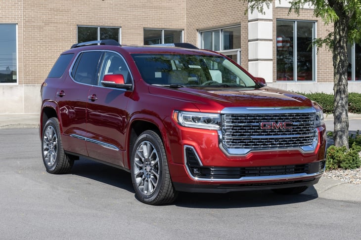 GMC Acadia SUV at a dealership. GMC offers the Acadia in SLE, SLT, AT4 and Denali models.