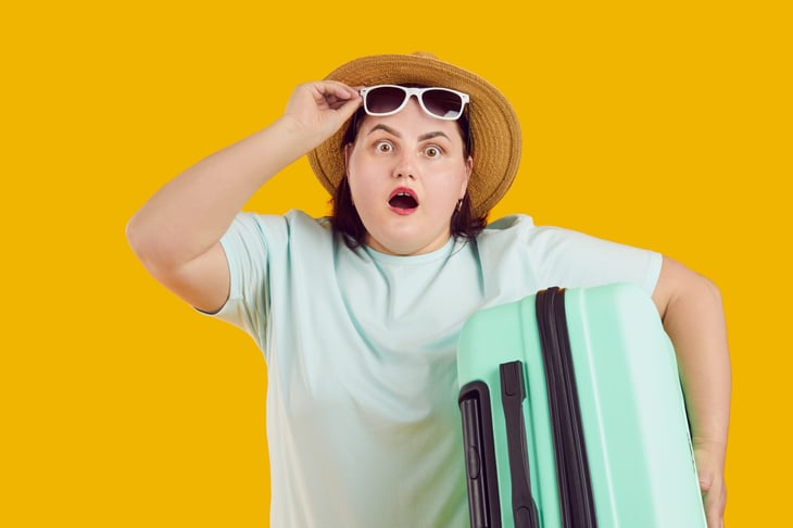 shocked woman with luggage