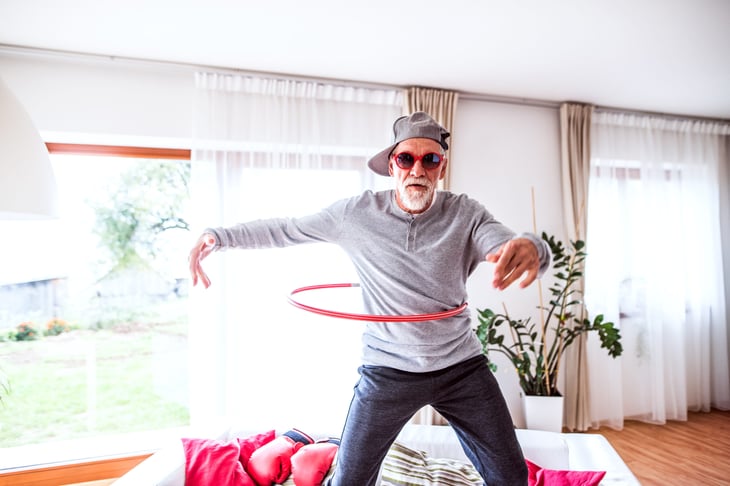older man with hula hoop