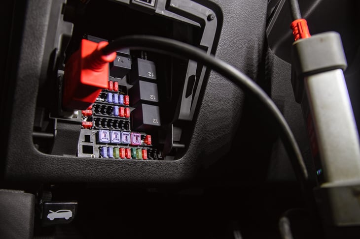 Fuse block panel in a car full of fuses