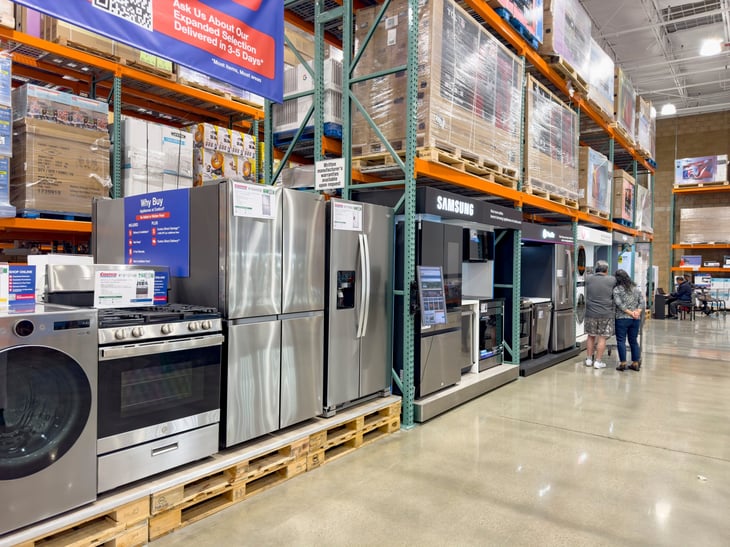 A display of kitchen and large appliances on display at a Costco warehouse store