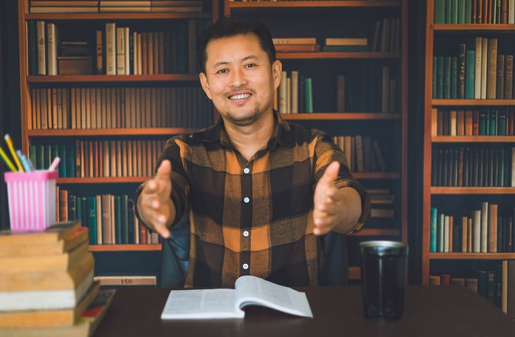 Man reading a book at home