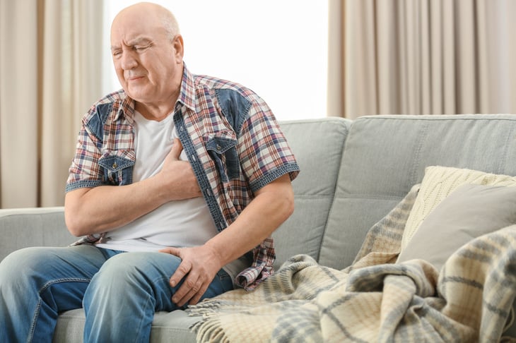 Senior suffering a heart attack or chest pain