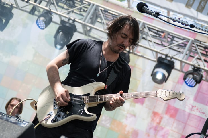 Guitarist Dhani Harrison performing at a concert