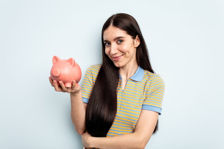 woman holding piggy bank