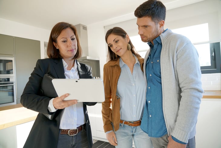 Couple with a real estate agent