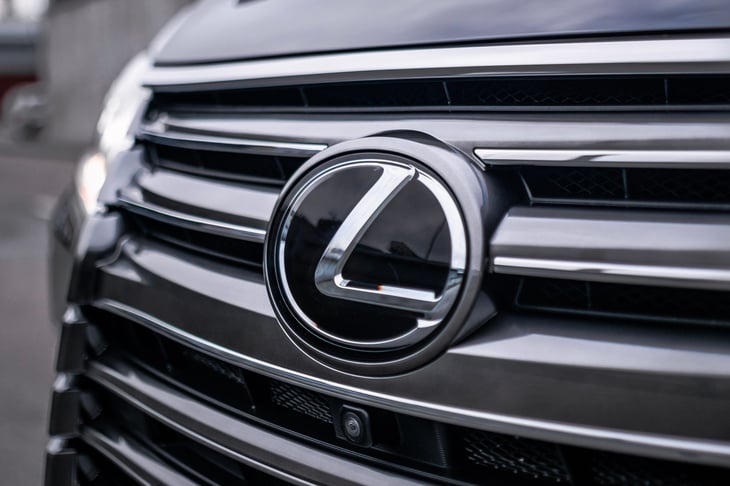 The Lexus logo at the front of a car.