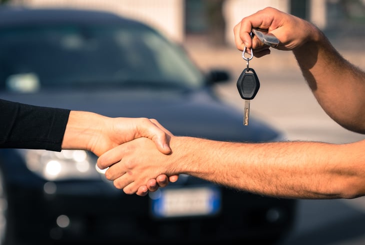 A man selling his car.