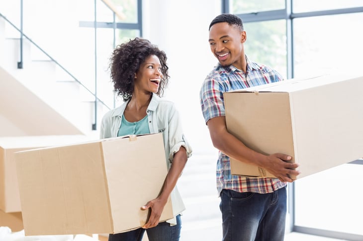 Young couple packing up and moving