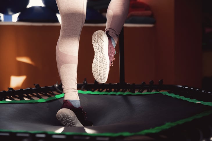 woman jumping on mobile mini trampoline