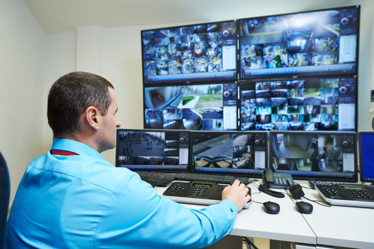 Security guard watching video feeds