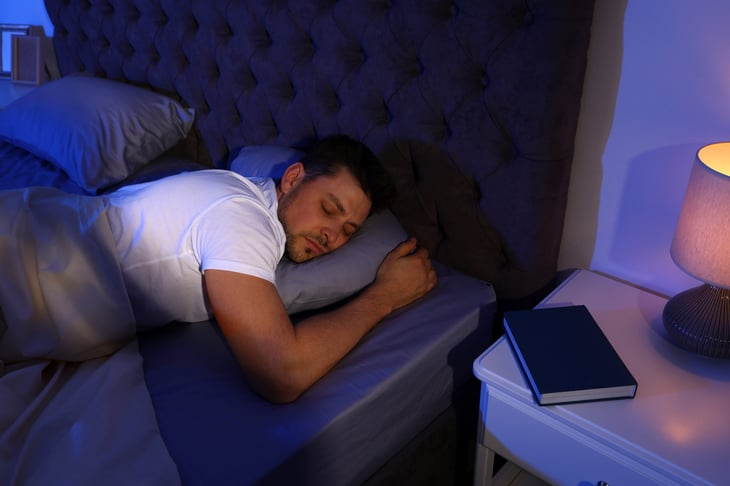 Man sleeping with a nightlight on