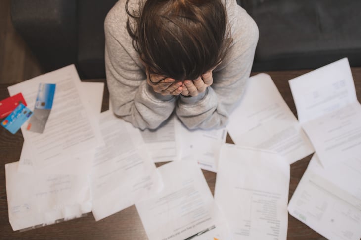 A woman stresses out over her bills.