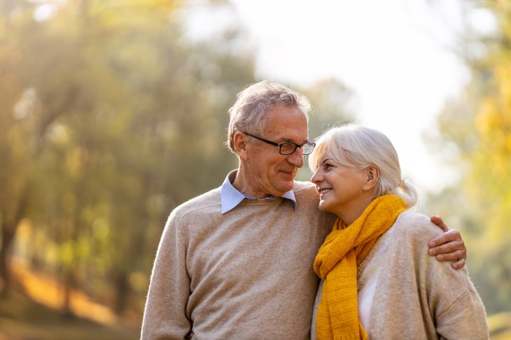 A retired couple outside.