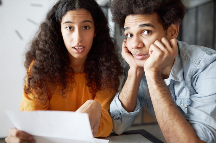 Young couple shocked by a high bill