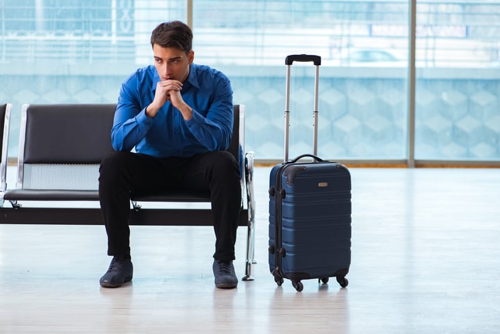 Man stuck at airport gate.