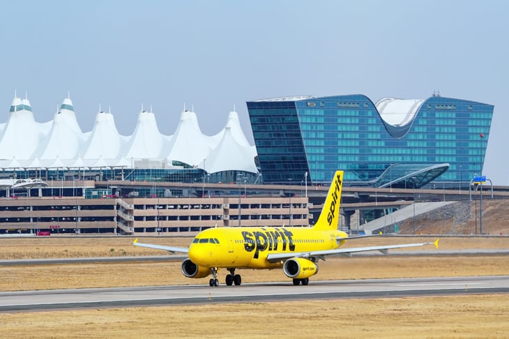 Spirit Airlines airplane on the runway at Denver International Airport
