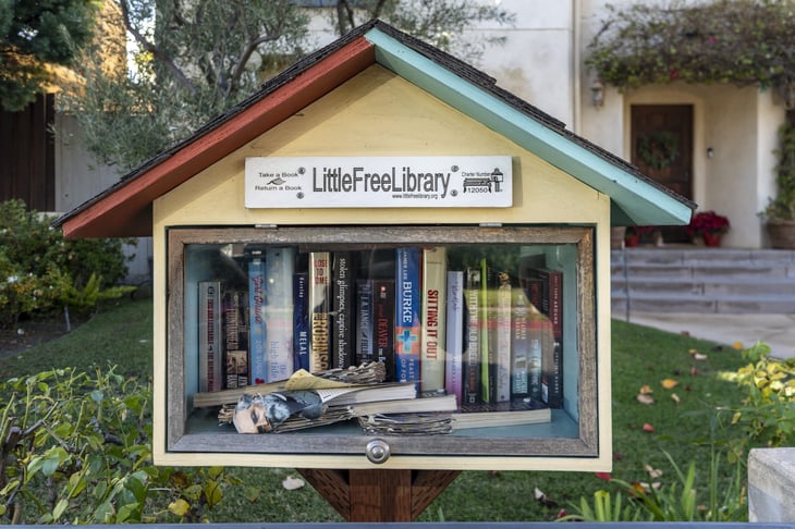 Little free library in the front yard of a home