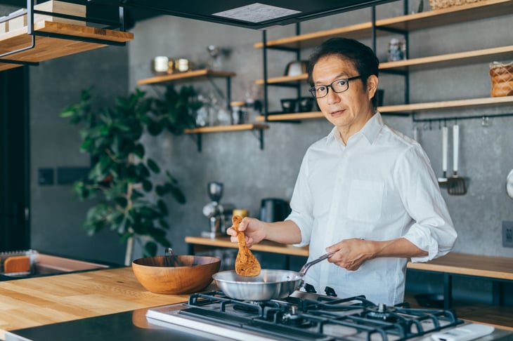 Man cooking on a stovetop