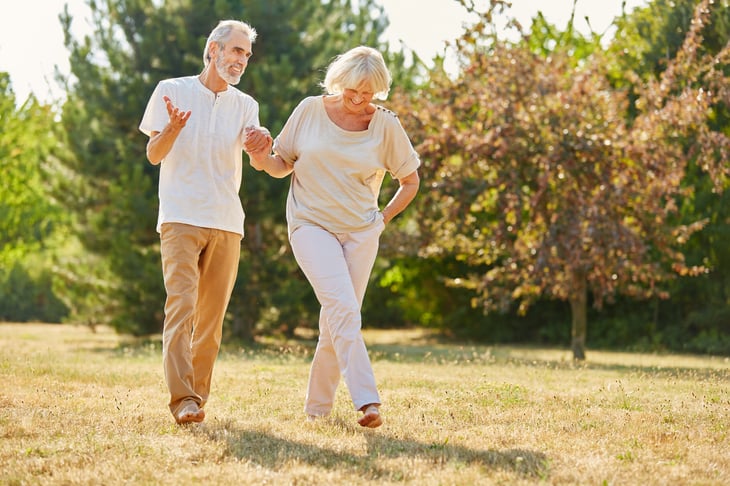 Happy retired couple on a walk.