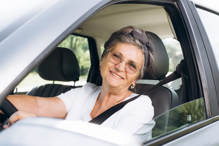 An older woman in the car.