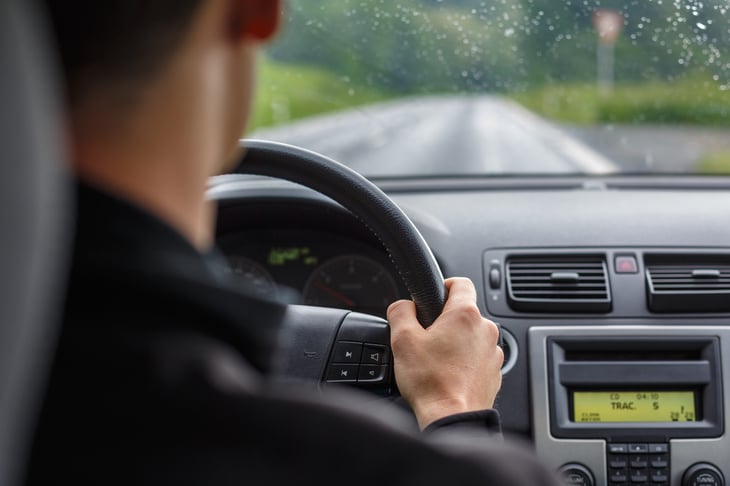 A man driving through a storm.