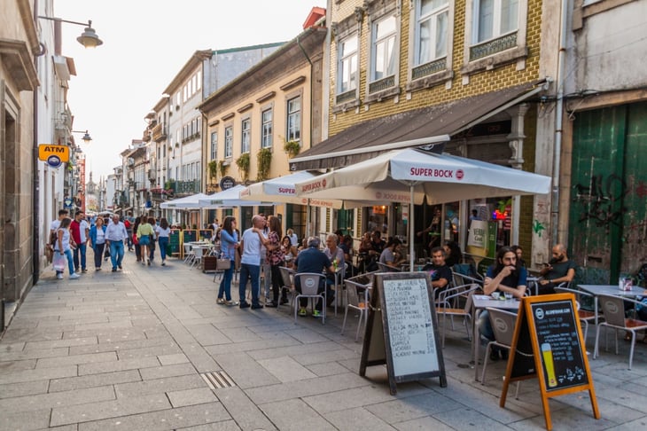 Dom Diego de Sousa pedestrian street with Arch of the New Gate, in Braga, Portugal
