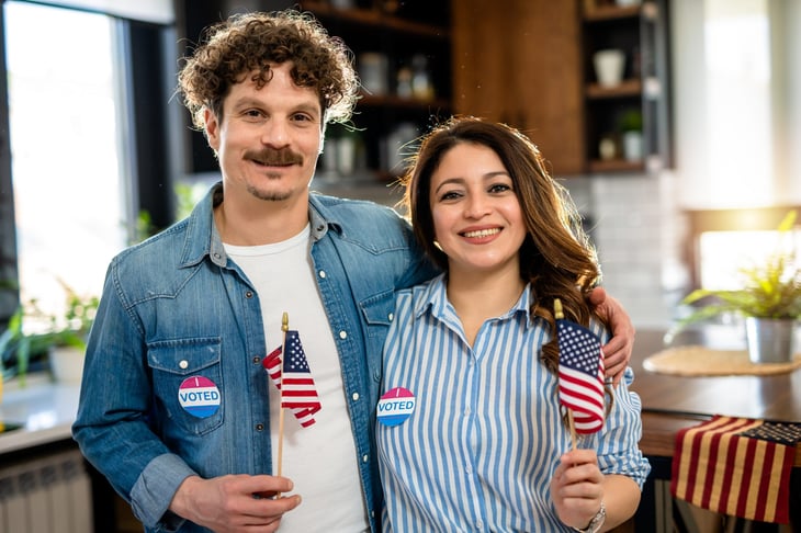 Male and female voters with American flags
