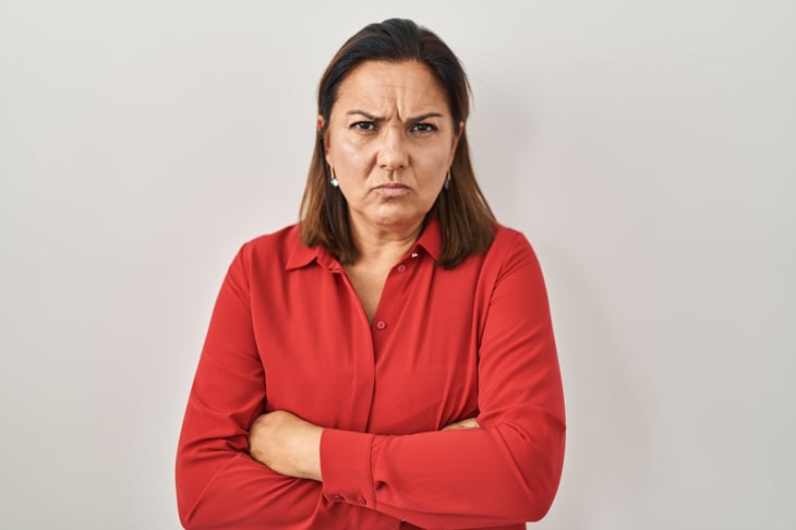 Angry older woman with her arms crossed