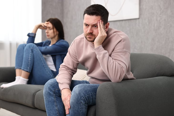 Offended, arguing couple ignoring each other