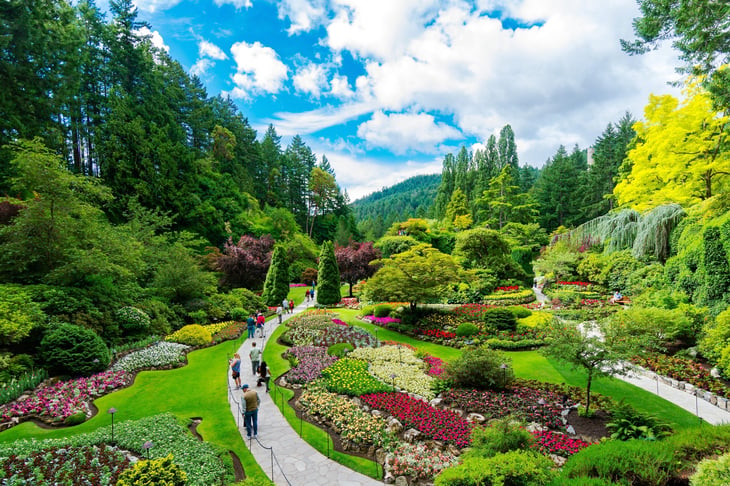 Victoria, British Columbia, Canada - Tourists at Butchart Gardens Sunken Garden