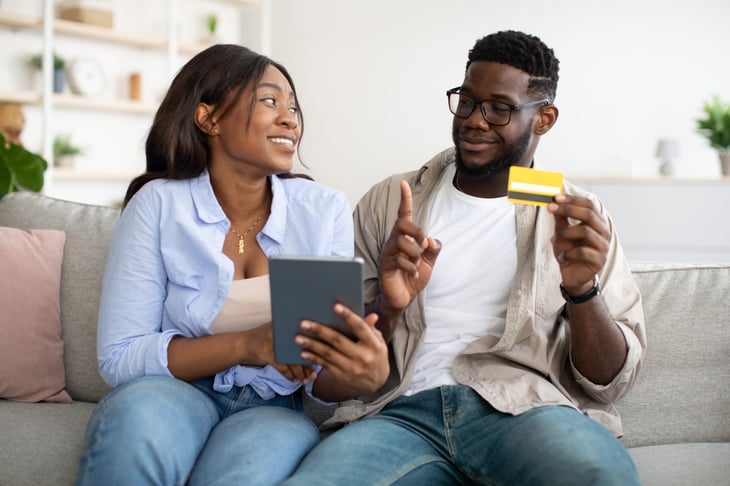 Man telling woman not to buy something.