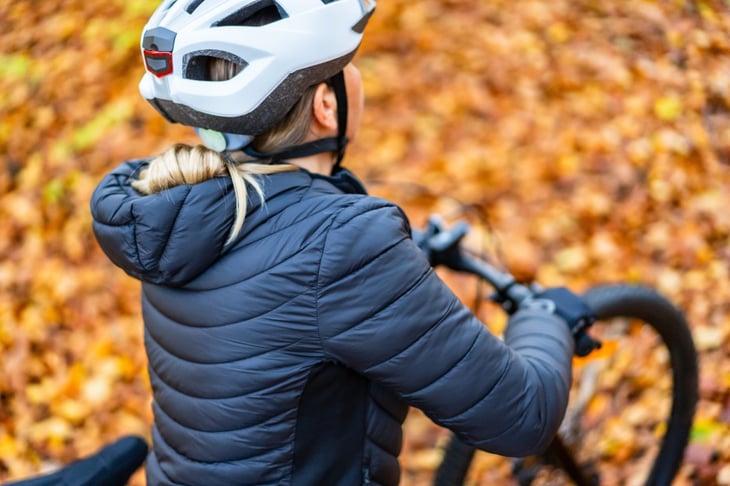 Woman riding a bike in autumn