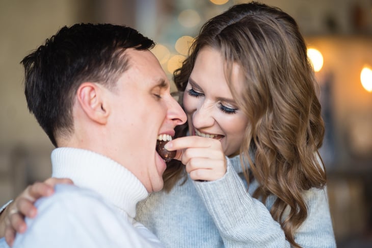 Couple eating chocolate