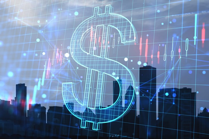Dollar sign in front of a city backdrop
