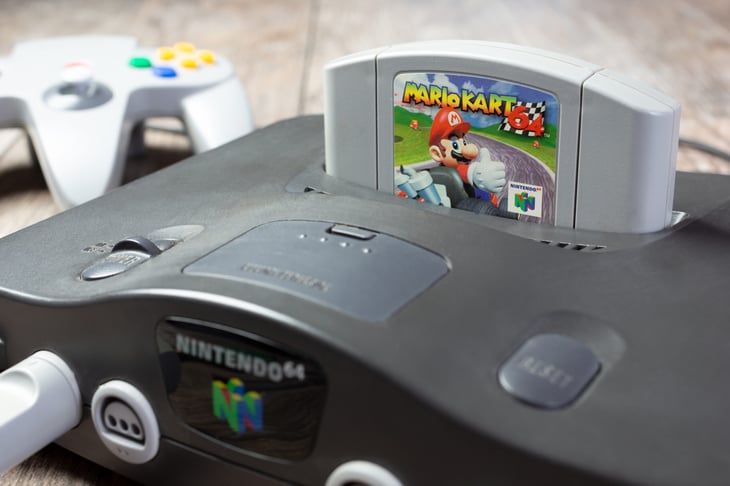 Nintendo 64 game console, with a Mario Kart 64 game cartridge.