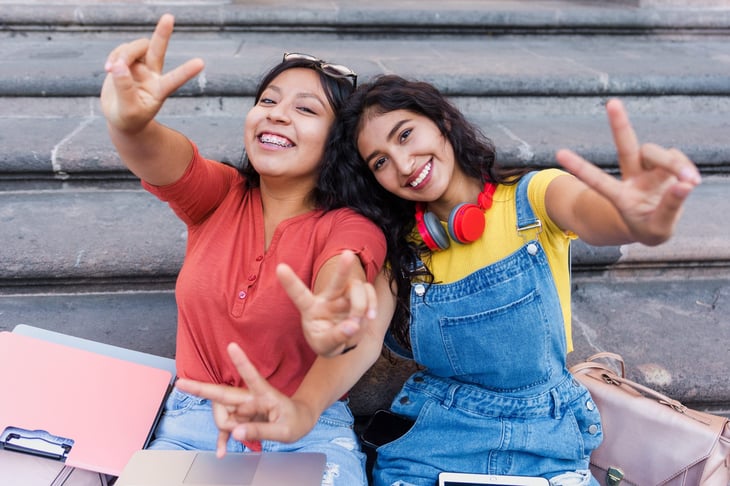 Two college students smiling on campus