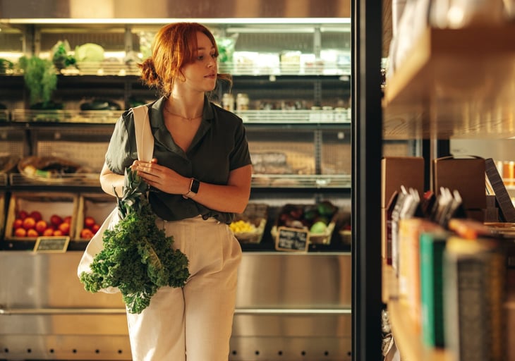 A woman grocery shopping.