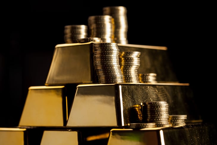 Gold bars and coins in a stack