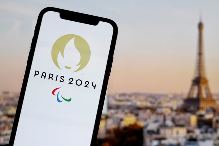 The Paris Paralympics 2024 logo on a smartphone screen with the Eiffel tower in the background.