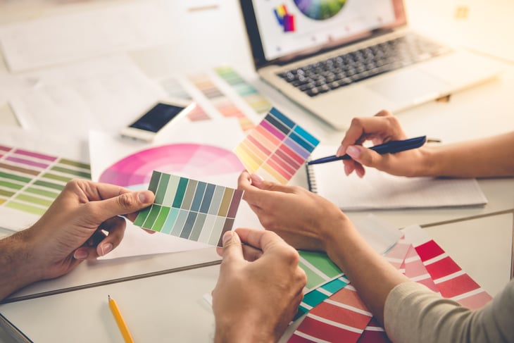 Designers looking color schemes and swatches