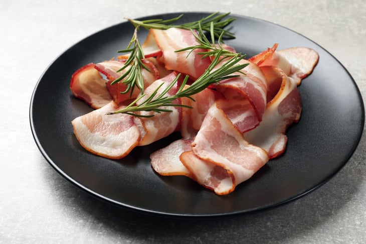 Raw bacon on a plate