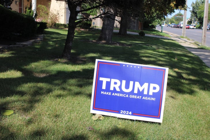 Trump 2024 campaign sign in someone's front yard.