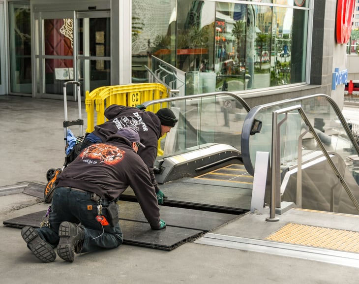 Workers repairing an escalator on Las Vegas Boulevard.