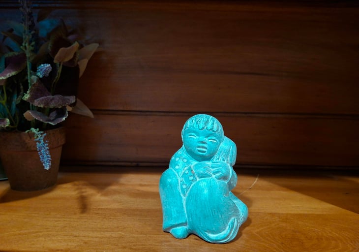 Vintage Isabel Bloom sculpture of a child hugging a dog