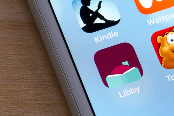 Libby mobile app icon is seen on an iPhone. Libby, built by OverDrive, is a free app where users can borrow ebooks and digital audiobooks from public libraries.