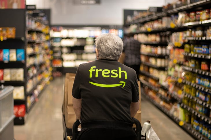 Man in the grocery store wearing Amazon Fresh shirt