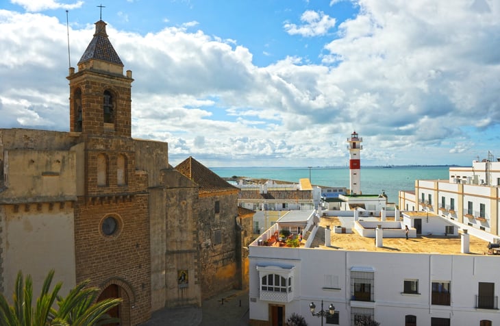 Rota with the church of O and the lighthouse from Castillo de Luna (Luna Castle). Rota province of Cádiz Andalusia Spain