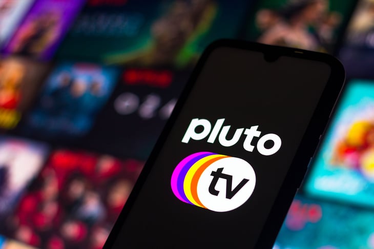 The Pluto TV logo displayed on a smartphone