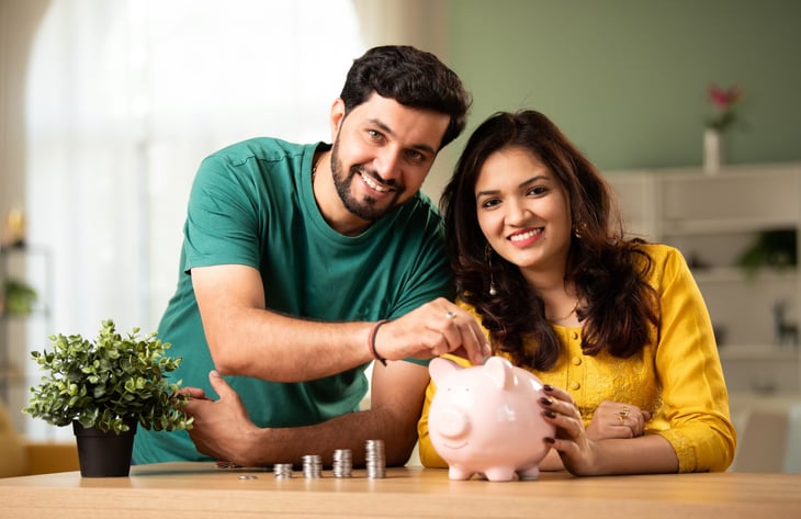Couple with a piggy bank